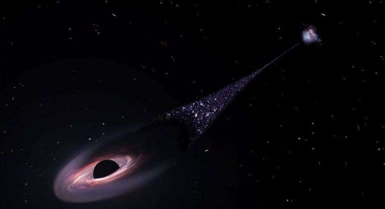 Nasa vê pela primeira vez buraco negro com rastro de estrelas cruzando o espaço